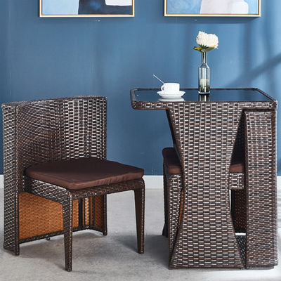Muebles de rotín para exteriores para cafeterías Conjunto de mesa y silla de vidrio templado