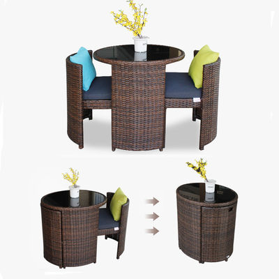 Mesa de comedor y silla redonda de vidrio templado de ratán para cafetería de diseño moderno