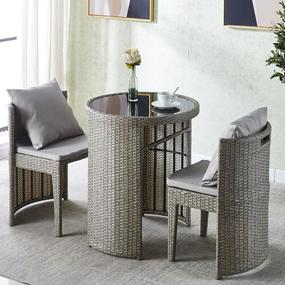 Mesa de comedor y silla redonda de vidrio templado de ratán para cafetería de diseño moderno