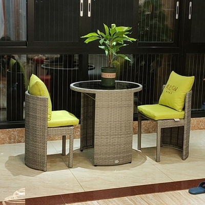 Mesa de comedor y silla redonda de vidrio templado de ratán para cafetería de diseño moderno